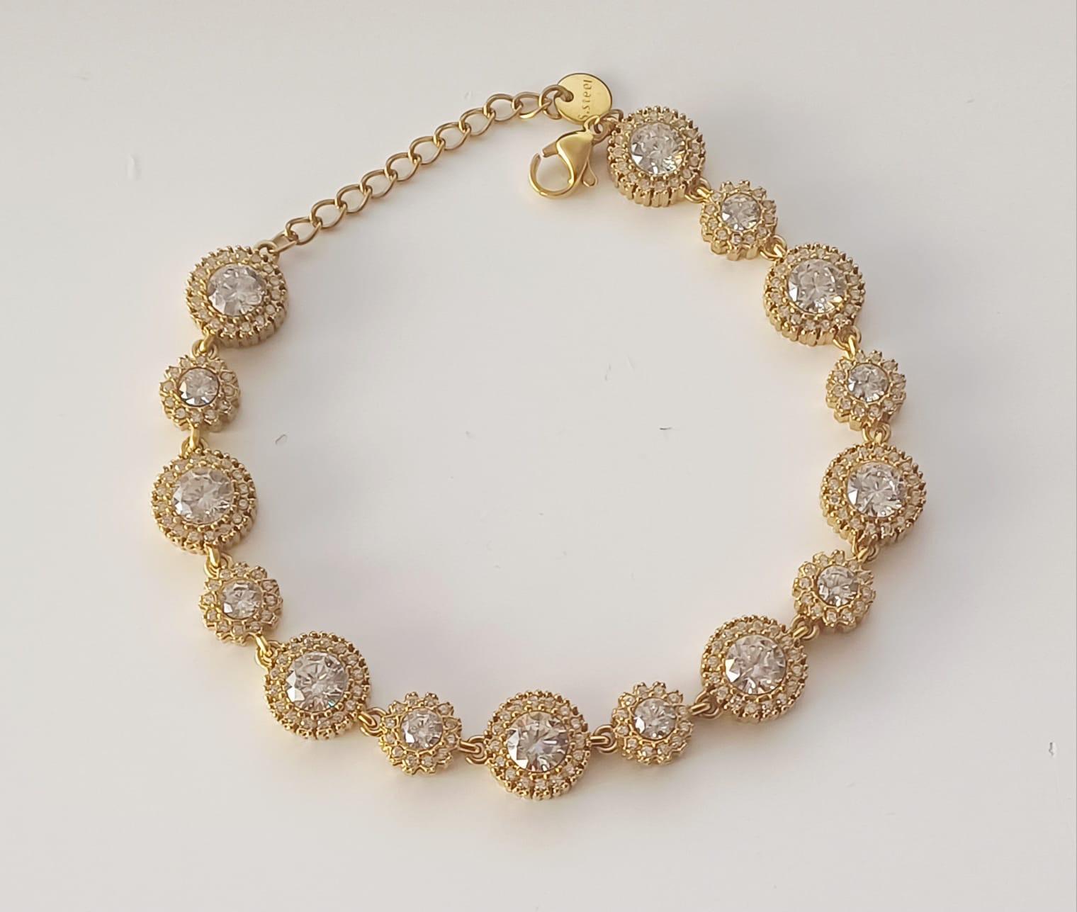 Bracelet chaîne doré à motifs ronds sertis de strass